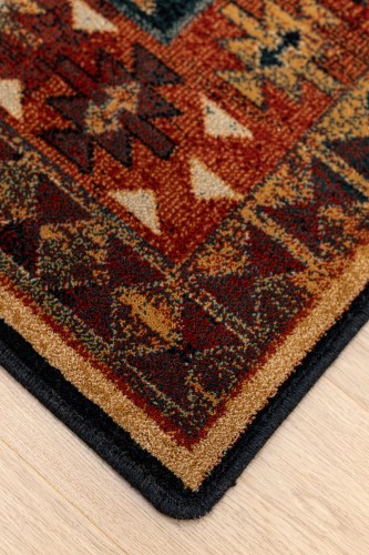 Brzeg dywanu  wełnianego Dywilan Omega Rohan kolor jasny rubin