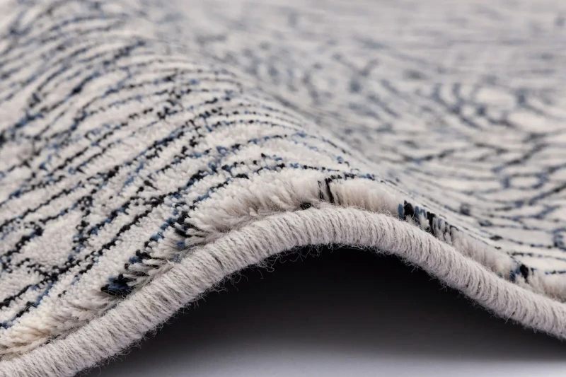 Dywan wełniany nowoczesny Agnella Isfahan Bellona jasny szary - obszycie wełniane dywanu