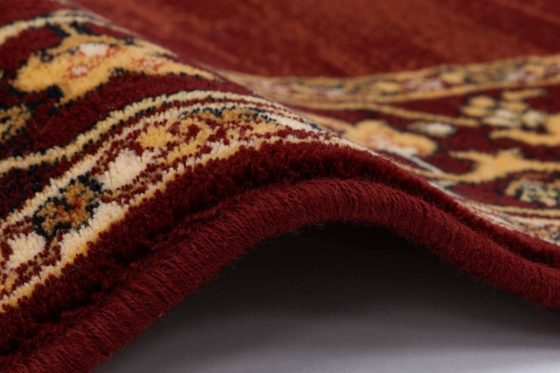 Obszycie wełniane dywanu Agnella Isfahan Uriasz kolor rubin