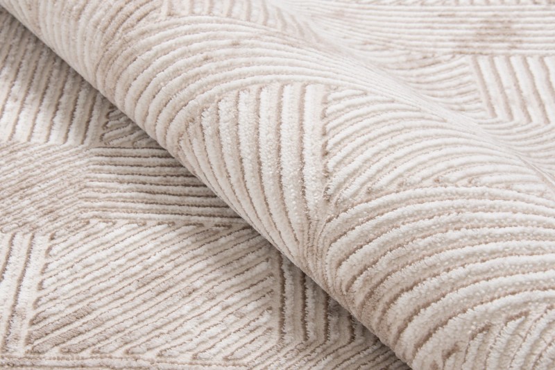 Zbliżenie runa beżowego dywanu art deco Anett E800AC