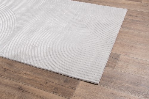 Rzut z boku na szary dywan art deco Anett E409AT