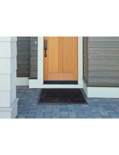 Wycieraczka podgumowana Tivoli Liście czarny przed drzwiami
