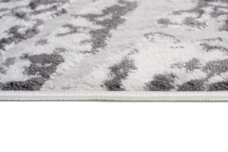 Dywan Sky FM31D w odcieniach szarości z wzorem przekroju pnia - brzeg