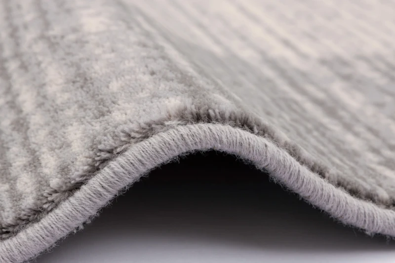 Dywan wełniany Agnella Isfahan M Cyryna jasny szary runo i obszycie