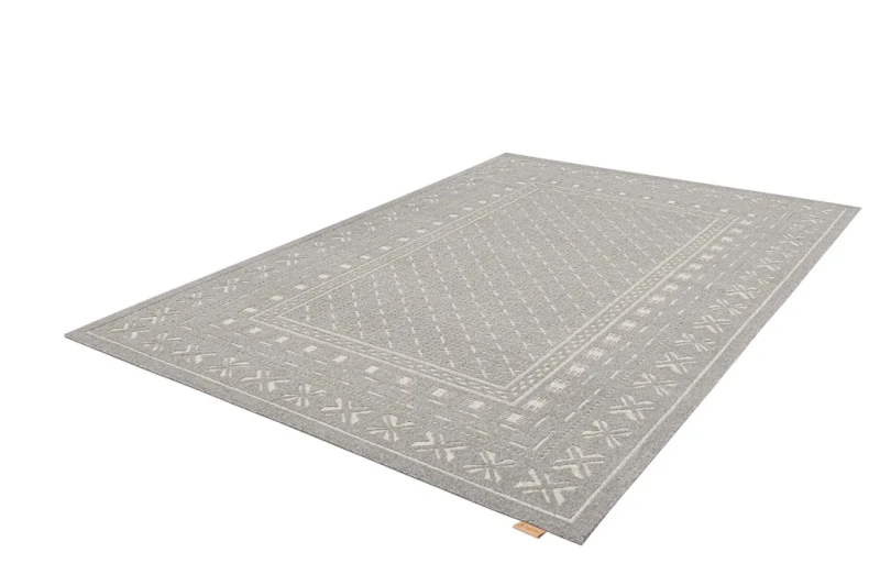 Dywan tradycyjny Agnella Noble Blockprint szary - rzut ukośny