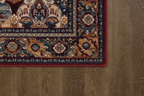 Róg dywanu wełnianego Agnella Isfahan Forenza kolor bordowy w rozmiarze 1,60x2,40 m
