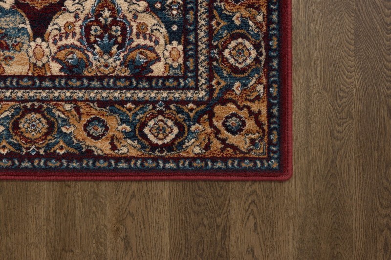 Róg dywanu wełnianego Agnella Isfahan Forenza kolor bordowy w rozmiarze 1,60x2,40 m