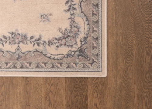 Dywan wełniany Agnella Isfahan Dafne alabastrowy - zdjęcie rogu dywanu