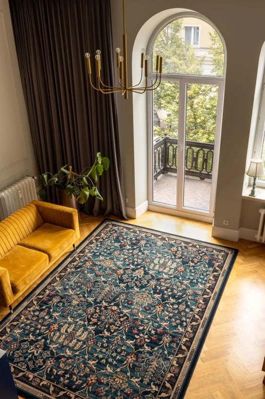 Dywan wełniany Agnella Isfahan Amara szmaragd w salonie