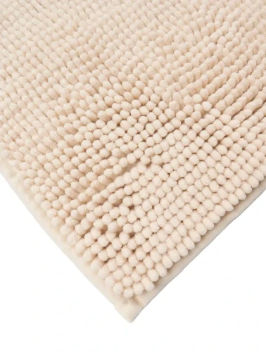 Róg kremowego dywanika łazienkowego Chenille soft