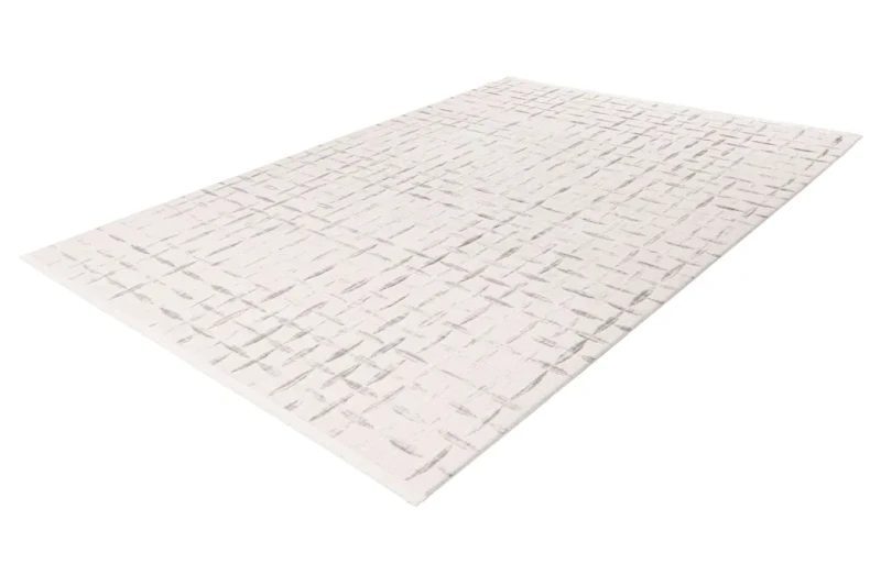Rzut z ukosa geometrycznego dywanu 3d Lalee Pierre Cardin Jardin JAR 706 szaro-kremowego
