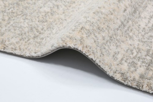 Dywan wełniany Agnella Calisia M FAM alabaster - zdjęcie krawędzi dywanu wykończonego taśmą ozdobną (binding)