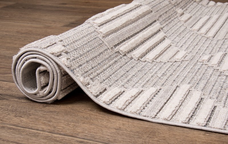 Szary dywanu boho Monaco 135A zwinięty w rulon