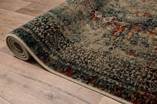 Zwinięty w rulon, brzegi dywanu Dywilan Omega Mamluk w kolorze szmaragdowym